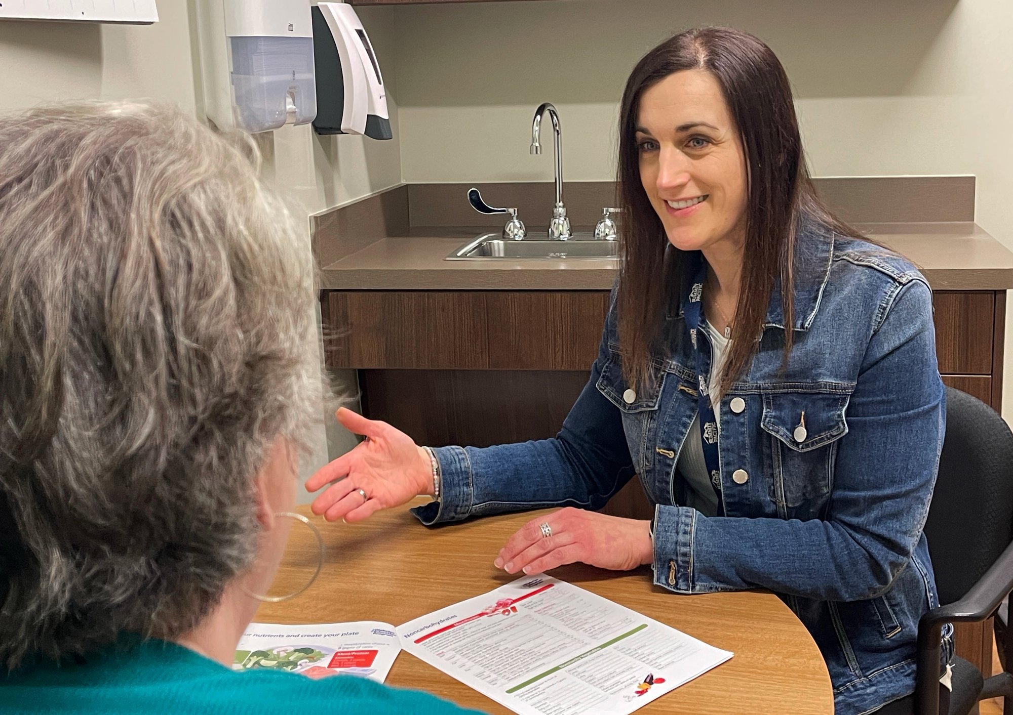 Sarah Carossino meeting with a patient